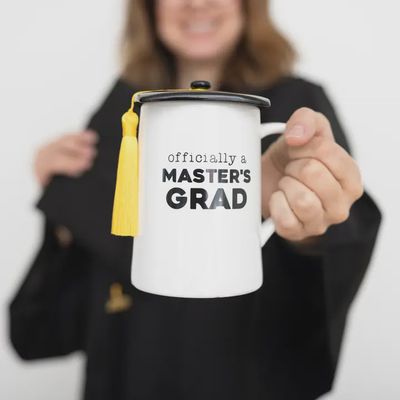 Pavilion Master's Grad ceramic mug with lid in a lifestyle setting, 17 oz capacity with ceramic construction and matching lid