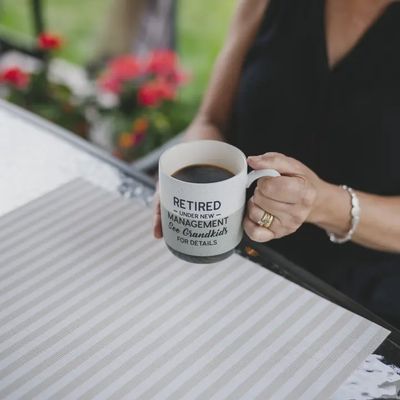 Retired Pavillion 15 oz stoneware mug displayed in a lifestyle setting, showing the ceramic construction and glazed finish