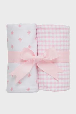 Two pink burp cloths made from cloth diaper fabric, displayed flat against a white background in studio lighting