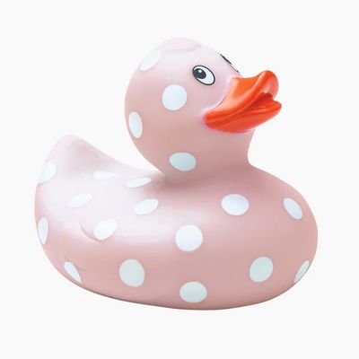 Baby pink rubber duckie with white polka dots, BPA-free bath toy displayed on neutral background in studio setting