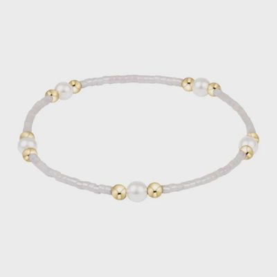 Hope Purpose Pearl Bracelet in silky white beads on a neutral background, studio product shot