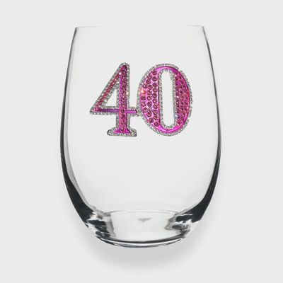 Jeweled stemless wine glass with crystalline embellishments celebrating a 40th birthday, isolated on white background
