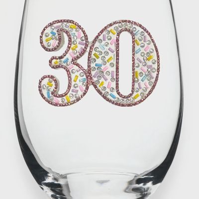 Clear stemless glass with jeweled embellishments and 30th birthday design, photographed against a white studio background