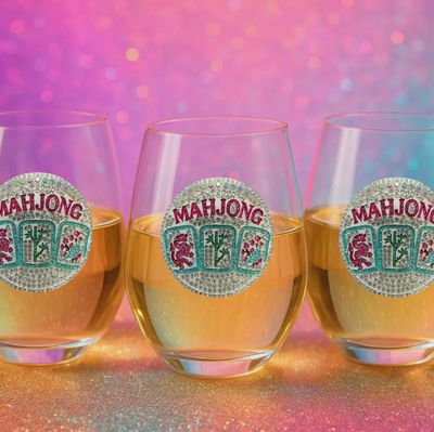 The Queen's Jewels Mahjong stemless wine glass with jeweled detailing on a neutral background