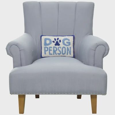 Dog Person wool hooked throw pillow in 8x12 inch size displayed on a couch or seating area