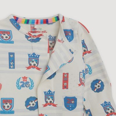 Child wearing Magnetic Me Team Goals USA RightFit modal footie in a lifestyle setting, showcasing the magnetic closure design and comfortable fit