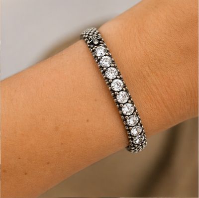 French Kande Austrian Crystal Bangle Bracelet – Sterling Silver Plated Adjustable Swarovski Crystal Cuff Close-up of Swarovski crystal sterling silver plated bangle bracelet worn on wrist highlighting adjustable cuff and sparkling