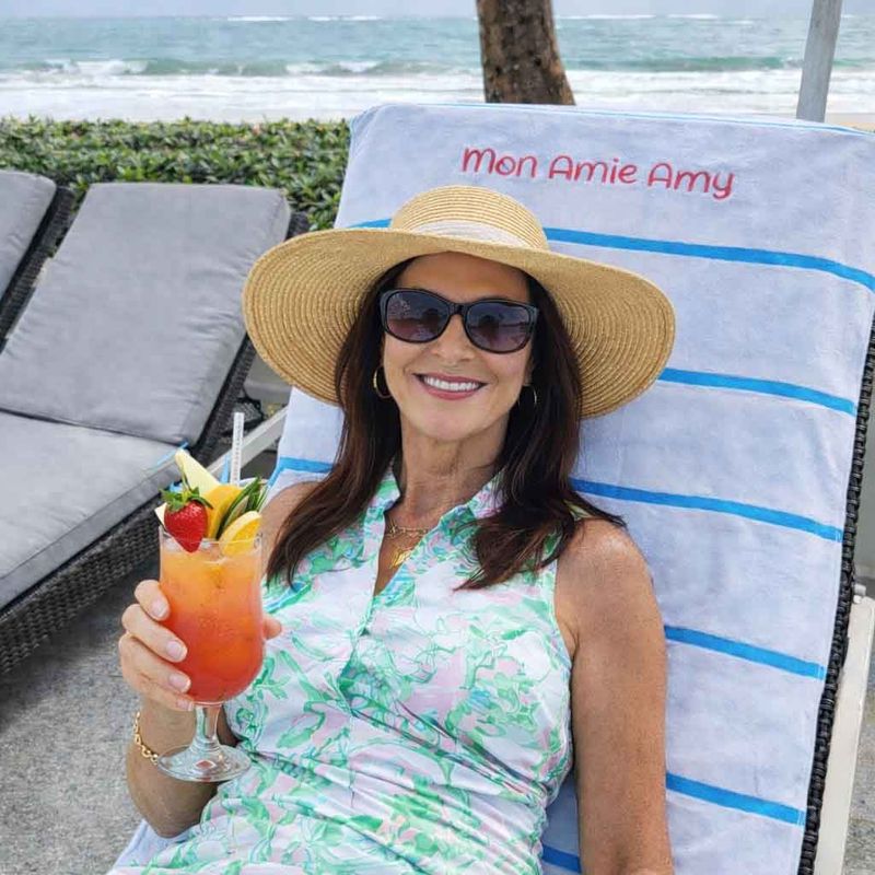 personalized monogram beach chair towel with pocket flap woman relaxing poolside holding cocktail embroidered name towel