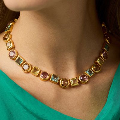 Julie Vos Jolie tennis necklace in 24K gold plate worn as a layered necklace in a lifestyle setting