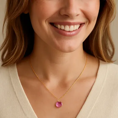 Gold Reflection small charm necklace with February birth month charm worn in a lifestyle setting