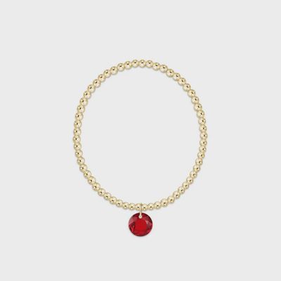 Gold 3mm beaded stackable bracelet with Reflection charm detail on white background