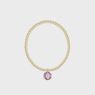 Gold beaded 3mm bracelet with reflection charm on white background, studio product shot