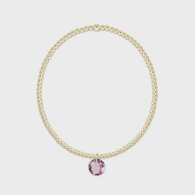 Gold 2mm beaded bracelet with small February Reflection charm, displayed on white background