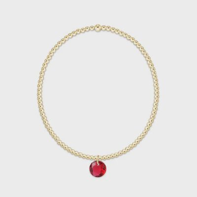 Gold 2mm beaded bracelet with July Reflection charm pendant on white background