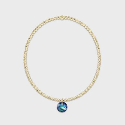 Gold 2mm beaded bracelet with December Reflection charm displayed on neutral background