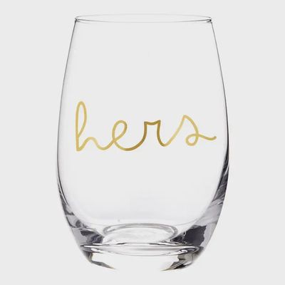 Two stemless wine glasses from Santa Barbara Design Studio His/Hers set displayed in a lifestyle setting with wine