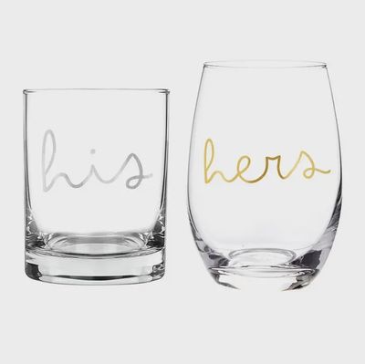 Two clear stemless wine glasses from Santa Barbara Design Studio His/Hers set on white background