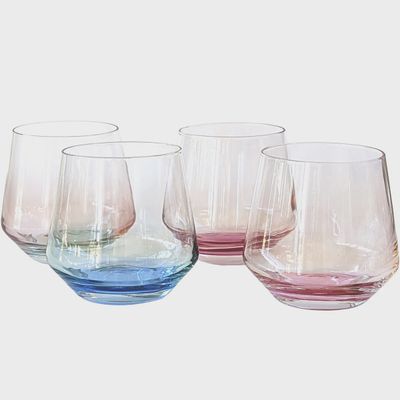 Set of four clear Mezclada stemless glasses arranged on white background, studio product shot