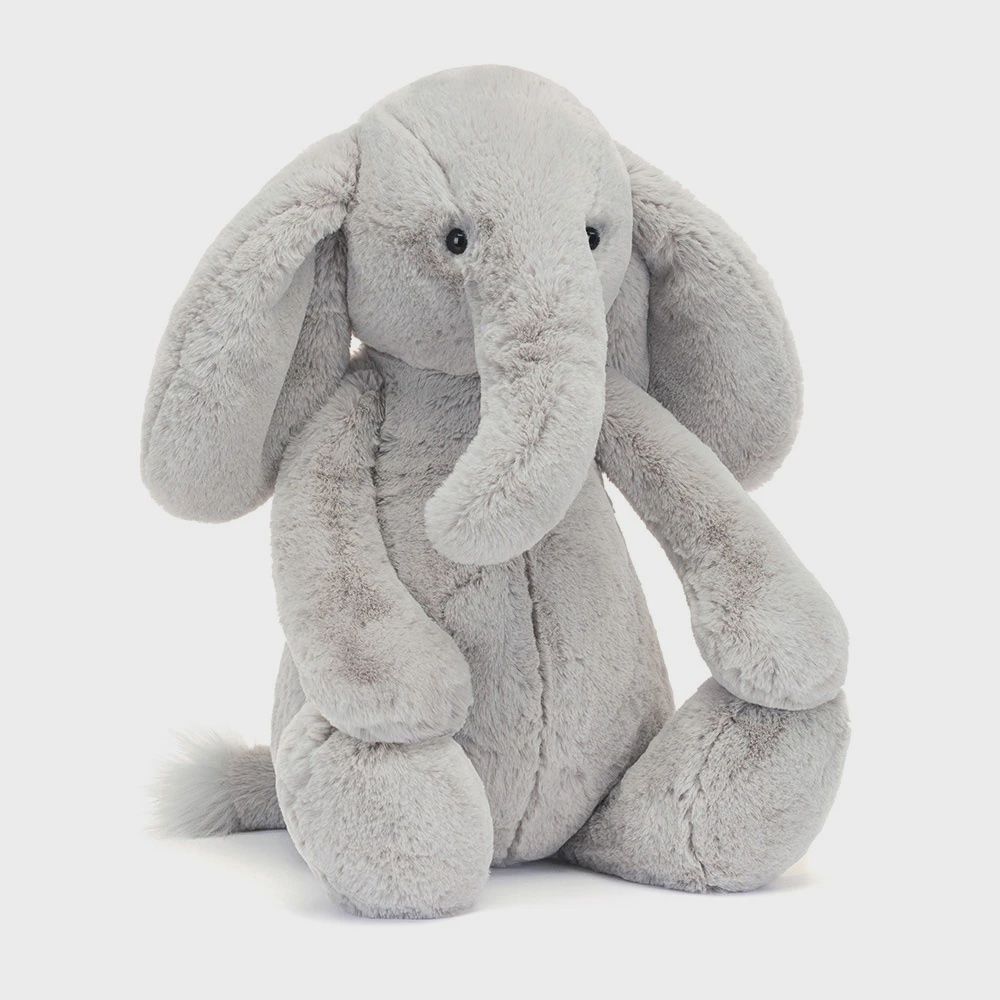 Jellycat Bashful Luxe Elephant Thuddeus plush toy in soft gray fabric, displayed against a neutral studio background