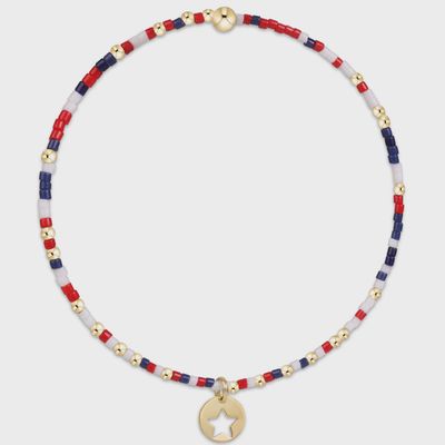 ENEWTON Hope Firecracker bracelet featuring a 14kt gold star disc charm on a beaded strand against a white studio background