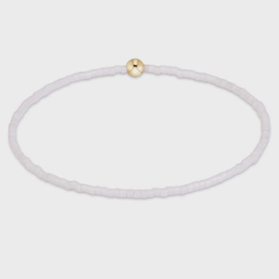White beaded bracelet with 14kt gold-filled accents and hardware, displayed on a neutral background