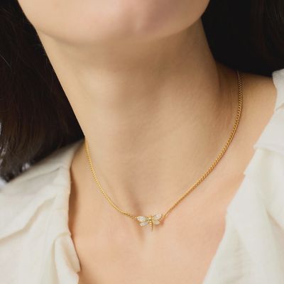 Julie Vos Dragonfly Pavé necklace in 24K gold plate with cubic zirconia stones, worn in a lifestyle setting