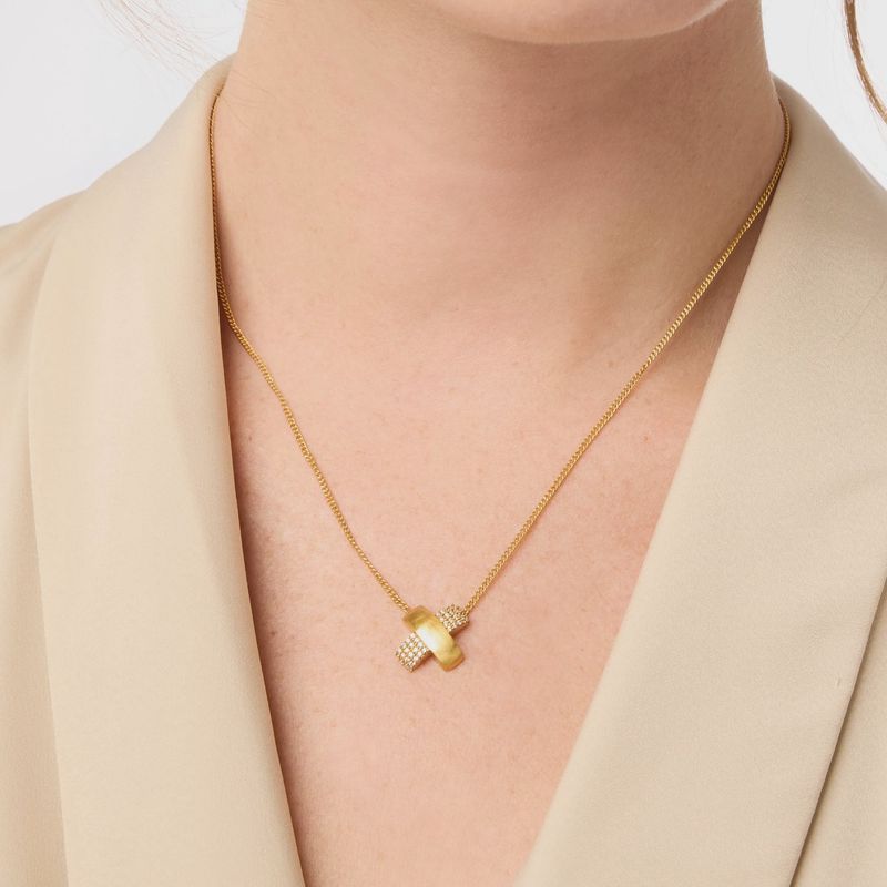 Julie Vos Catalina pavé bar necklace in 24K gold with cubic zirconia stones, shown worn in a lifestyle setting
