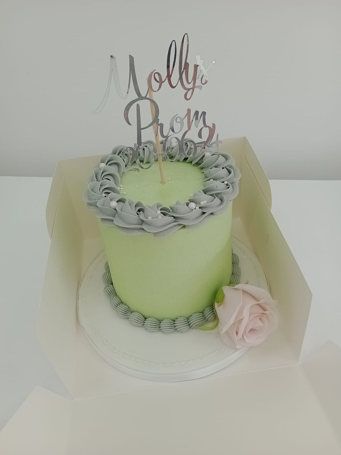 Classic simple buttercream cake with topper