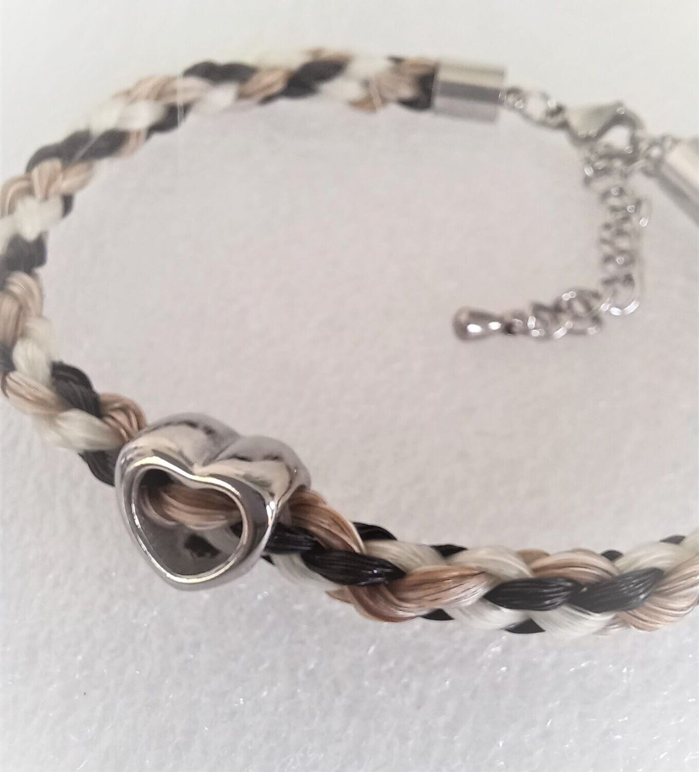 Horsehair keepsake bracelet made using your own horses hair with an open heart charm. Stainless steel silver coloured findings. Memory jewellery