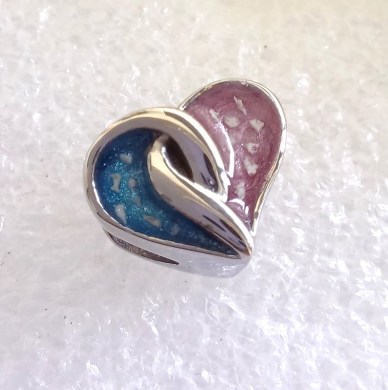 Stainless steel entwined heart charm bead. Each side can contain fur, hair or ashes you provide. Keepsake Jewellery. Memorial Jewellery. Memory Jewellery