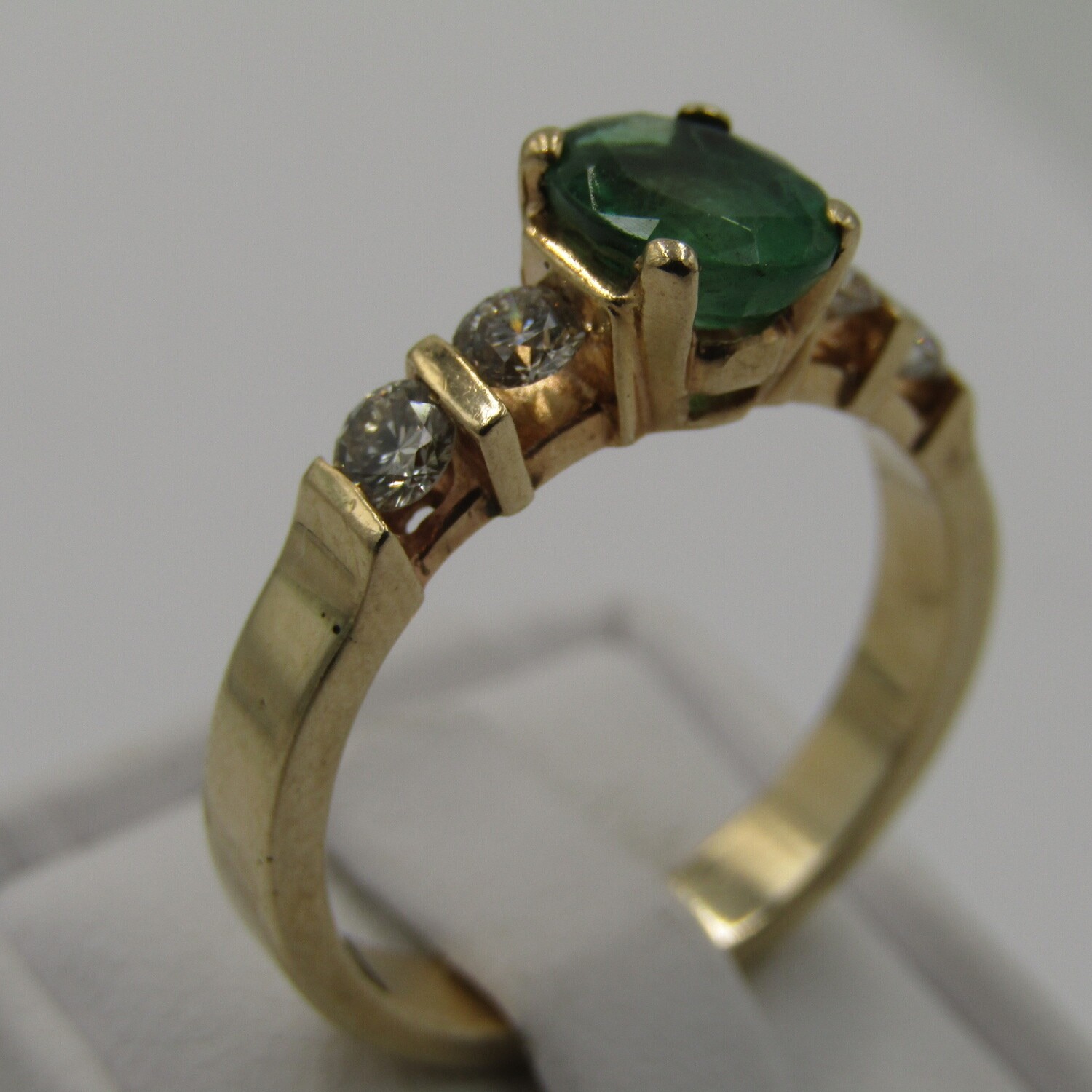 14kt Yellow Gold ring with 4 diamonds totalling 60 points SI / G and emerald of 95 points bought on the Ocean Village 2 during 2008 for R25 000 on a Crew Ship - Size R 1/2