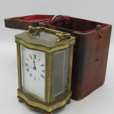 Antique brass carriage clock in original case - runs and stops