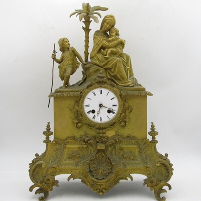 Antique French brass clock with mother and boys under tree