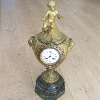 Antique French Ormolu urn clock with stone base