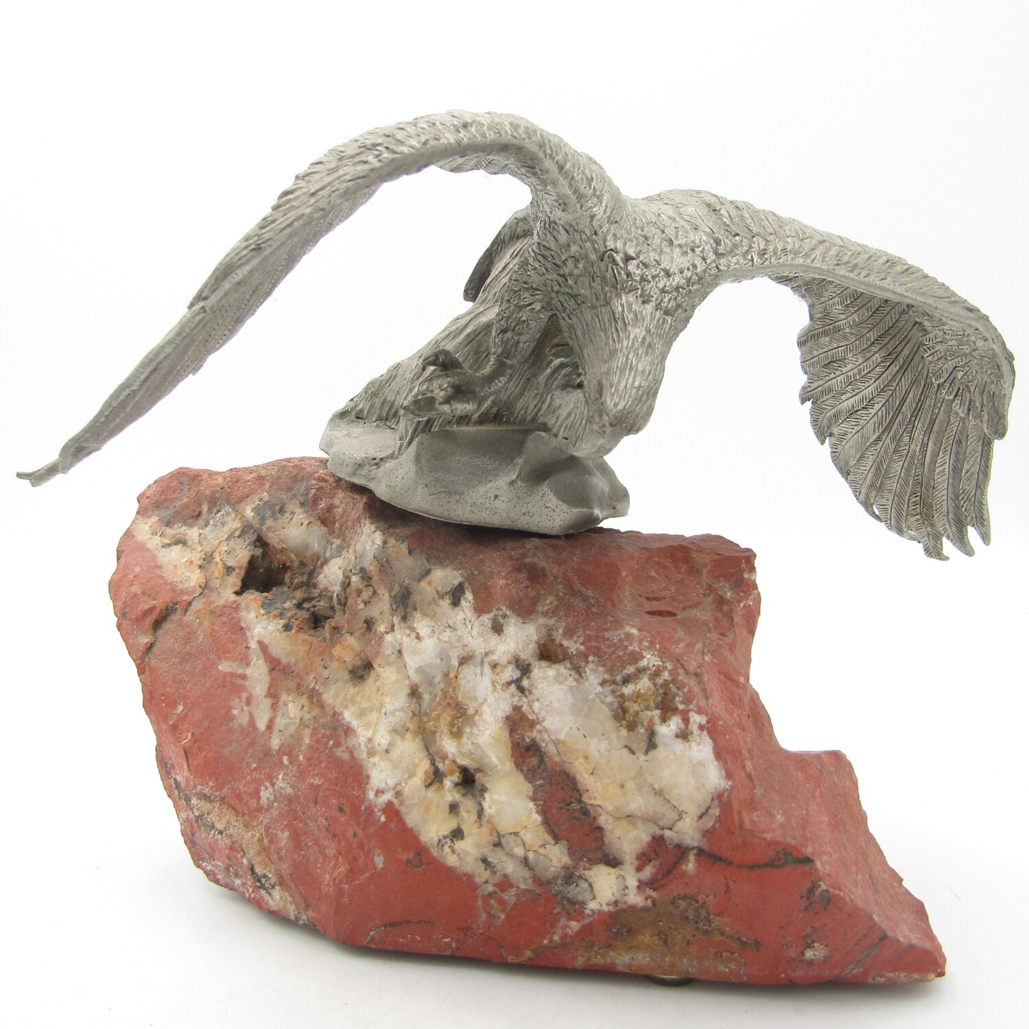 Beautiful white metal eagle sculpture on stone base