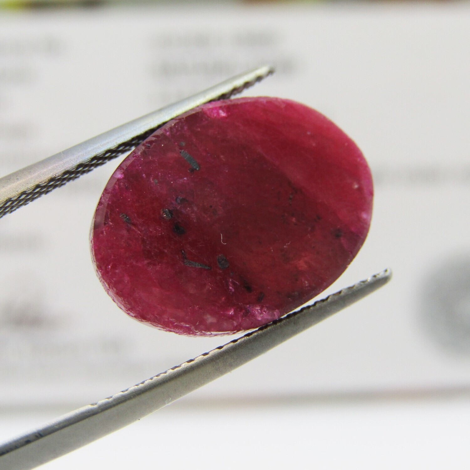 Natural Ruby of 13,8 carat oval checkerboard dark toned slight violet red with Gemlab certificate