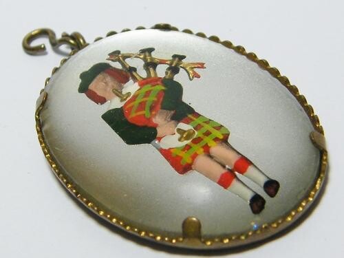 Antique Reverse Intaglio Essex crystal pendant with Scottish bagpipe player
