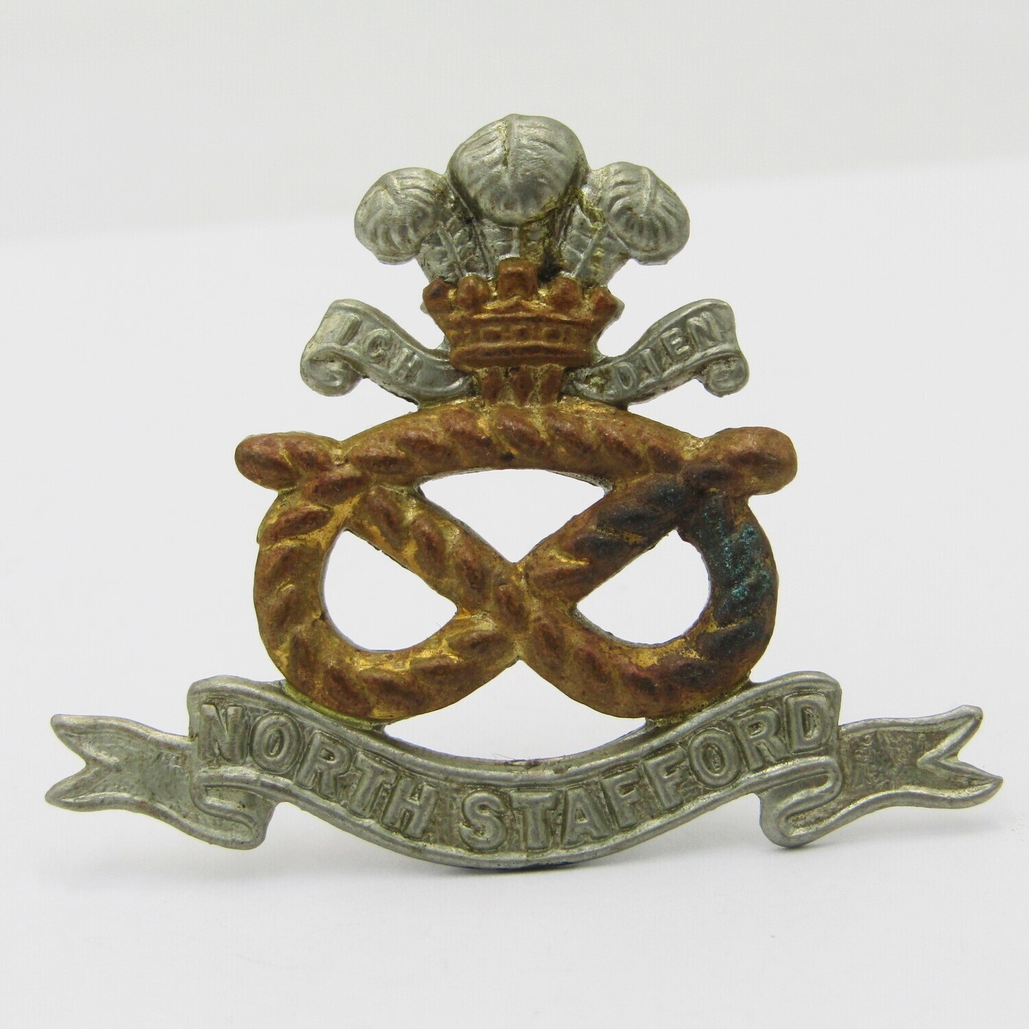 North Staffordshire regiment cap badge with lugs