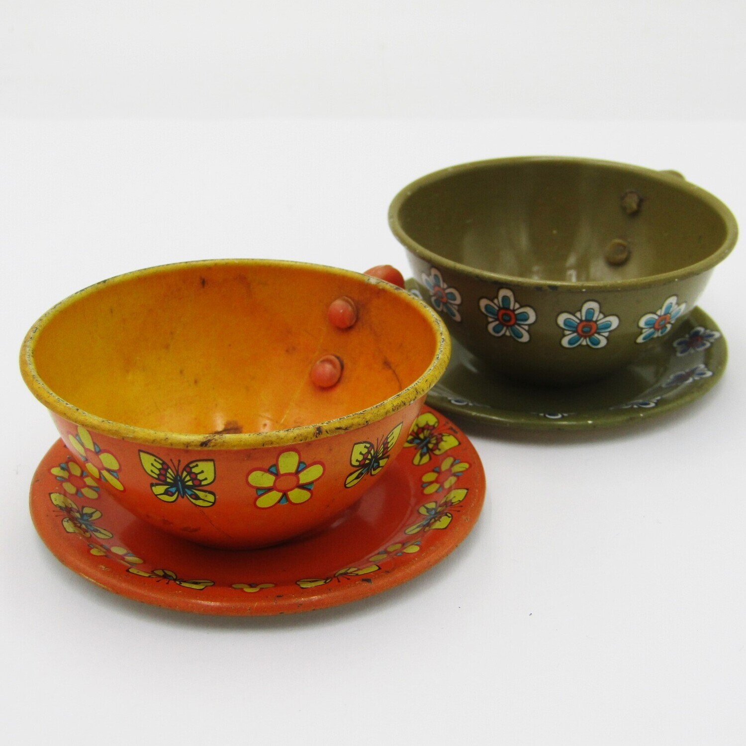 Pair of vintage tinplate doll house cups and saucers