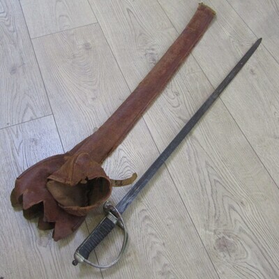 Royal Artillery sword in leather sleeve who belonged to TEJ St Vaughan who was a Lieutenant commander in the Royal Navy