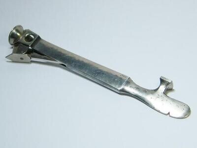 Vintage cigar cutter and pipe tool with silver sides