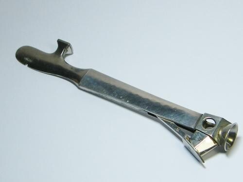 Vintage cigar cutter and pipe tool with silver sides