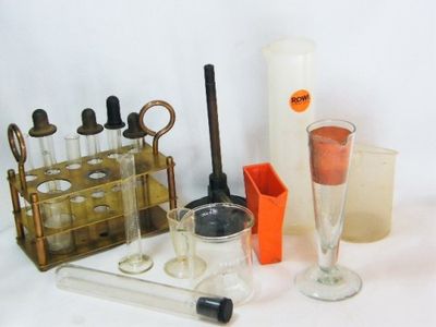 Lot of photography darkroom chemical measuring equipment with brass stand