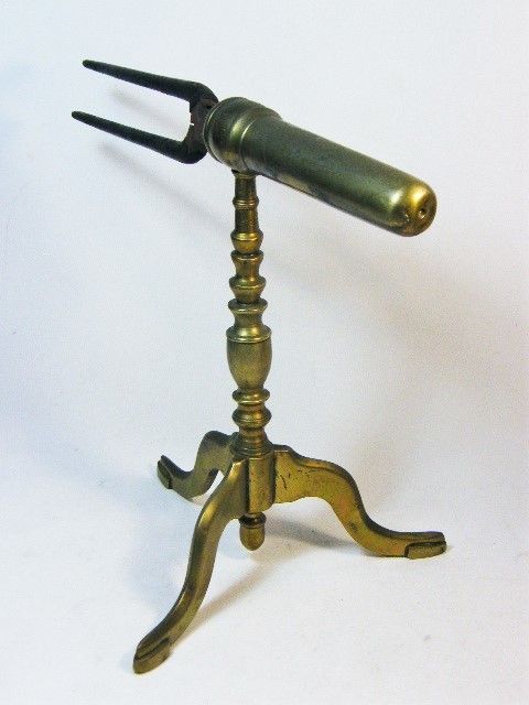 Antique curling tongs with brass cooling stand