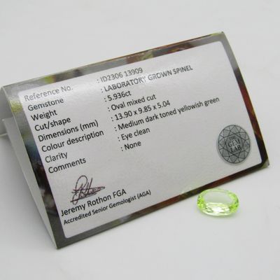 Lab grown Spinel of 5,936 carat - oval mixed cut - Medium dark toned yellowish green - identical to a natural stone at a fraction of the price - with Gemlab certificate