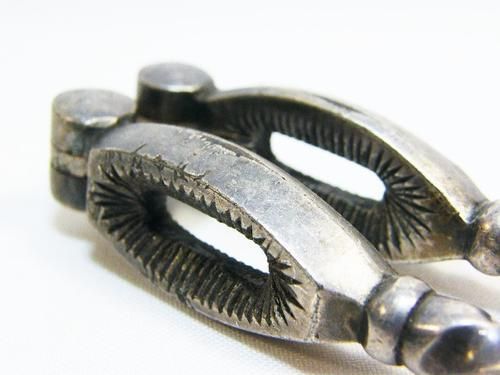 Antique silverplated nutcracker with twisted arms
