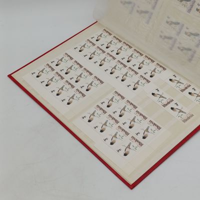 Excellent condition 16 page stamp album with 380 mint stamps and 120 mint Aloe stamps of Rhodesia