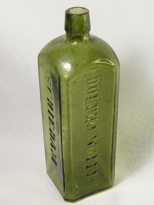 Dolpho Wolfe`s Aromatic Schnapps green antique glass bottle
