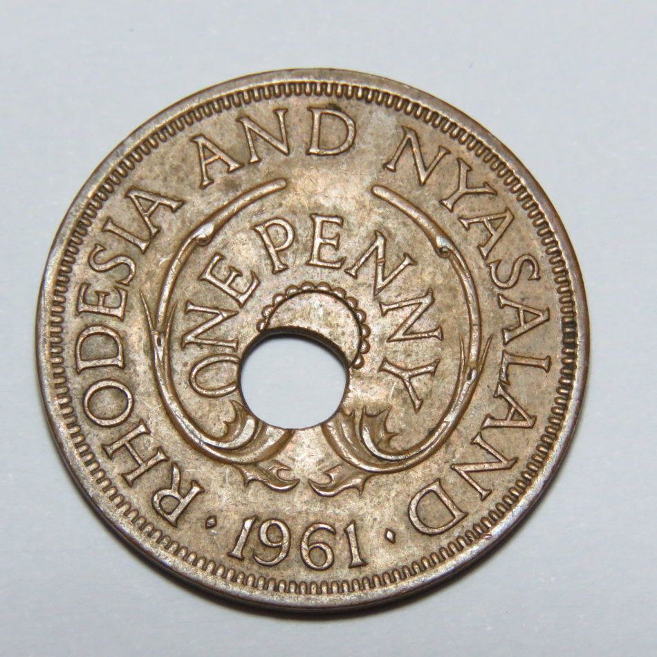 1961 Rhodesia and Nyasaland penny with misstruck hole