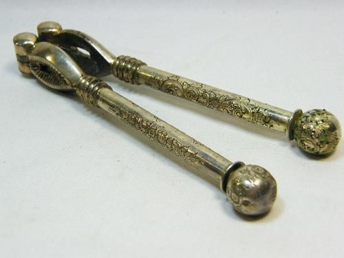 Vintage silverplated nutcracker with flower pattern handles